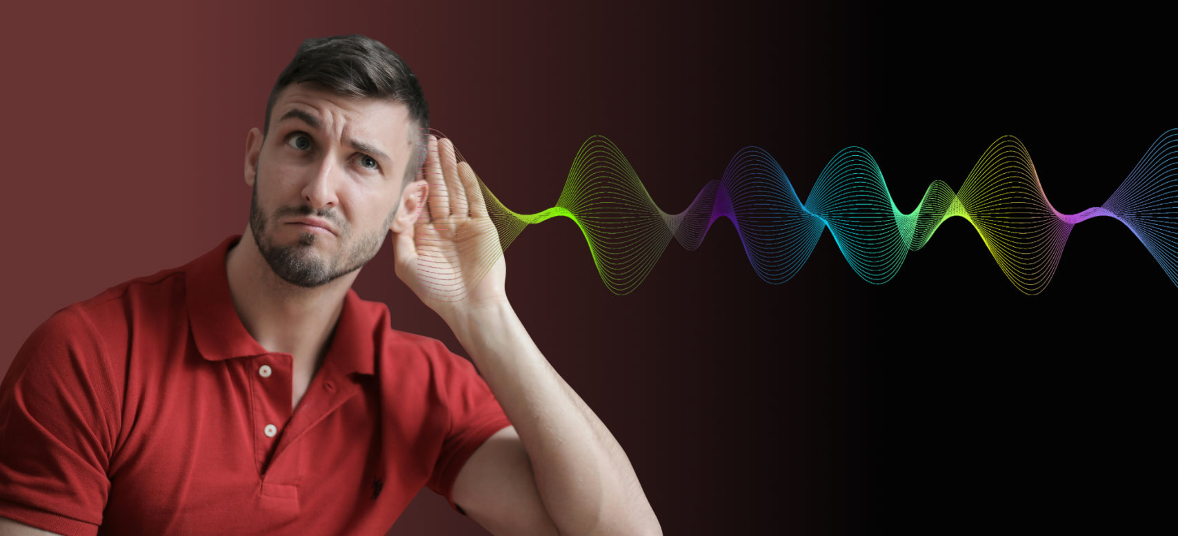 Young man wearing red t-shirt cupping his ear